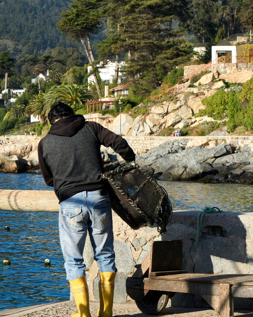 Fisherman mending nets in a southern Chile fishing village