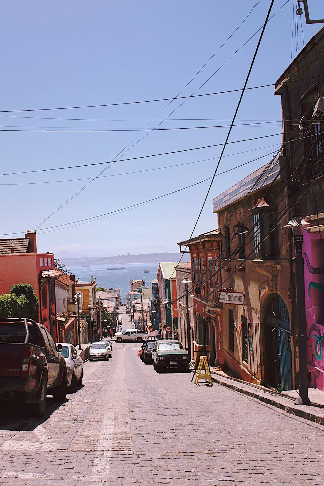 Colorful street in Valparaíso Chile with a local resident